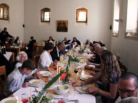 Lunch with guests on a feast day in the abbey's refectorium.